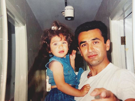 Young Isabel Pakzad with her father.